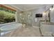 Bright bathroom featuring a garden tub, glass shower, and a vanity with granite countertop at 9526 Greyson Ridge Dr, Charlotte, NC 28277