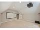 Large bonus room with projector, screen, and neutral decor, perfect for entertaining at 9526 Greyson Ridge Dr, Charlotte, NC 28277