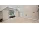 Large bonus room with neutral carpeting, projector screen, and built in storage at 9526 Greyson Ridge Dr, Charlotte, NC 28277