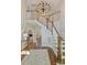 Grand foyer with high ceilings, chandelier, staircase, and hardwood floors with decorative rug at 9526 Greyson Ridge Dr, Charlotte, NC 28277