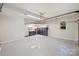 Spacious garage with storage cabinets, overhead racks, and epoxy flooring at 9526 Greyson Ridge Dr, Charlotte, NC 28277