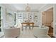 Bright home office with custom built-ins, natural light, and stylish furnishings at 9526 Greyson Ridge Dr, Charlotte, NC 28277