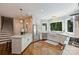 Well-lit kitchen with hardwood floors, a large window and stainless steel appliances at 9526 Greyson Ridge Dr, Charlotte, NC 28277