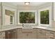 Bright kitchen with a view from the window above the sink and stainless steel dishwasher at 9526 Greyson Ridge Dr, Charlotte, NC 28277