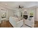 Spacious living room with hardwood floors, fireplace, and lots of natural light at 9526 Greyson Ridge Dr, Charlotte, NC 28277