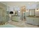 Luxurious bathroom with double vanity, soaking tub, tiled floors, and a glass shower at 9526 Greyson Ridge Dr, Charlotte, NC 28277