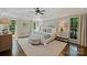 Bright main bedroom features a tray ceiling, natural light, neutral decor, and hardwood flooring at 9526 Greyson Ridge Dr, Charlotte, NC 28277