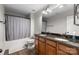 Bathroom features double sinks, granite countertops, and a shower-tub combo for added convenience at 1004 Craven St, Indian Trail, NC 28079