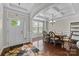Elegant dining room featuring a coffered ceiling, hardwood floors, and ample natural light at 1004 Craven St, Indian Trail, NC 28079