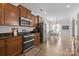 Cozy kitchen with stainless steel appliances, granite counter tops, and an adjacent dining area at 1004 Craven St, Indian Trail, NC 28079