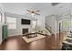 Inviting living room features a fireplace, ceiling fan, and hardwood floors, creating a cozy and stylish atmosphere at 1004 Craven St, Indian Trail, NC 28079
