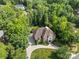 Aerial shot showcasing the home's location within a densely wooded neighborhood, emphasizing privacy and tranquility at 1009 Seminole Dr, Waxhaw, NC 28173