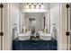 Modern bathroom vanity with double sinks, stylish fixtures, and ample counter space at 1009 Seminole Dr, Waxhaw, NC 28173