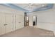 Bright bedroom with a ceiling fan, and doorways visible to an ensuite and hallway at 1009 Seminole Dr, Waxhaw, NC 28173