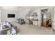 Large bonus room features a seating area and a built-in desk nook at 1009 Seminole Dr, Waxhaw, NC 28173