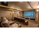 A home theater featuring comfortable seating and a large screen for entertainment at 1009 Seminole Dr, Waxhaw, NC 28173