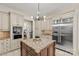 Spacious kitchen features an island, granite countertops, stainless steel appliances, and ample cabinet space at 1009 Seminole Dr, Waxhaw, NC 28173