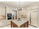 Gourmet kitchen with granite countertops, stainless steel appliances, and a large center island at 1009 Seminole Dr, Waxhaw, NC 28173