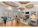 Bright living room boasts a fireplace, built-ins, coffered ceiling, and access to outdoor patio at 1009 Seminole Dr, Waxhaw, NC 28173