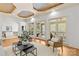 Spacious living room with hardwood floors, designer rug, multiple windows and access to other areas at 1009 Seminole Dr, Waxhaw, NC 28173