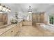 Luxurious main bathroom with dual vanities, a soaking tub, and a spacious walk-in shower at 1009 Seminole Dr, Waxhaw, NC 28173