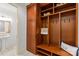 Organized mudroom with custom built-in storage, hooks, and a charming 'Home' throw pillow at 1009 Seminole Dr, Waxhaw, NC 28173