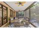 Relaxing screened porch with comfortable seating, brick accents, and views of the lush backyard at 1009 Seminole Dr, Waxhaw, NC 28173
