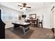 Bright game room with air hockey table, bar area, and ample space for entertainment at 10115 Paxton Run Rd, Charlotte, NC 28277