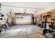 Well-organized garage featuring shelving, tools, exercise equipment, and ample space at 10115 Paxton Run Rd, Charlotte, NC 28277