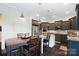 Updated kitchen featuring granite countertops, an island, and stainless steel appliances at 10115 Paxton Run Rd, Charlotte, NC 28277