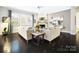 Cozy living room with fireplace, hardwood floors, and comfortable seating at 10115 Paxton Run Rd, Charlotte, NC 28277