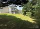 Large backyard features a green lawn, privacy fence and room for entertaining at 12244 Wallace Ridge Dr, Charlotte, NC 28269