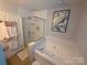 Bright bathroom featuring a separate shower and tub, complemented by modern fixtures and stylish decor at 12244 Wallace Ridge Dr, Charlotte, NC 28269