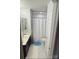 This bathroom has a combination of a vanity with dark cabinets and a shower with a white curtain at 12244 Wallace Ridge Dr, Charlotte, NC 28269