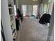 Bonus room with desk, shelving and three large windows with natural light at 12244 Wallace Ridge Dr, Charlotte, NC 28269