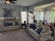 Spacious living room featuring neutral décor, plush sofas, and abundant natural light at 12244 Wallace Ridge Dr, Charlotte, NC 28269