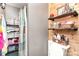 Bright bathroom with wooden accents, open shelving, and a neatly arranged toiletry display at 124 10Th Sw St, Conover, NC 28613