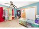 Eclectic bedroom featuring colorful textiles, window, and modern fan at 124 10Th Sw St, Conover, NC 28613