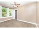 Bedroom with a ceiling fan, natural light, and neutral carpet at 124 10Th Sw St, Conover, NC 28613