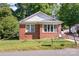 Charming single-story brick home with a well-maintained lawn and inviting curb appeal at 124 10Th Sw St, Conover, NC 28613