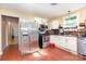 Functional kitchen with stainless steel appliances, white cabinets, and hardwood floors for easy maintenance at 124 10Th Sw St, Conover, NC 28613