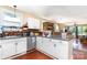 Bright kitchen features white cabinets, stainless steel appliances, and a view into the living area at 124 10Th Sw St, Conover, NC 28613