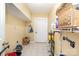 Bright laundry room with tiled floor, ample storage space, and convenient utility access at 124 10Th Sw St, Conover, NC 28613
