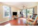 Inviting living room featuring large windows, hardwood floors, and a comfortable seating area for relaxation at 124 10Th Sw St, Conover, NC 28613