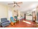Open living space features hardwood floors, natural light, and a seamless flow into the kitchen area at 124 10Th Sw St, Conover, NC 28613