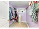 Walk-in closet with ample storage and unique design, featuring a window and view into another room at 124 10Th Sw St, Conover, NC 28613