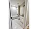 Modern bathroom features white tile flooring, matching bathtub, and white vanity with granite top at 1247 Beltline Rd # 1, Chester, SC 29706
