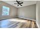Bedroom with hardwood floors, ceiling fan, and window letting in lots of light at 1247 Beltline Rd # 1, Chester, SC 29706