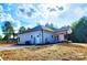 Exterior rear view of home with an inviting covered porch and freshly seeded yard at 1247 Beltline Rd # 1, Chester, SC 29706