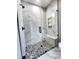 Modern shower with glass enclosure, marble tile, stone floor, and bench at 1247 Beltline Rd # 1, Chester, SC 29706